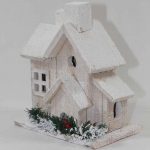 Zasnežený drevený led domček